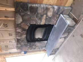 Native stone constructed fireplace